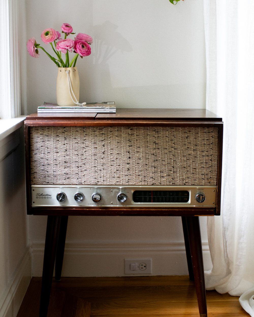 Vintage Silvertone console with pink ranunculus